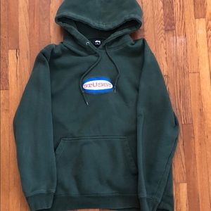 Stussy green sweatshirt with a hood